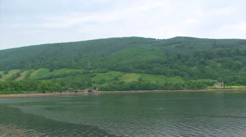 Loch Fyne at its head, two houses across the fjord Stock Footage 39988313
