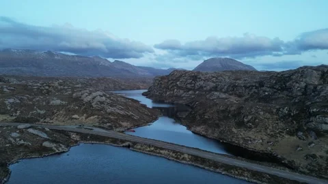 Loch na Thull and A838 NC500 Road Flyover, Scotland Stock Footage 323434957