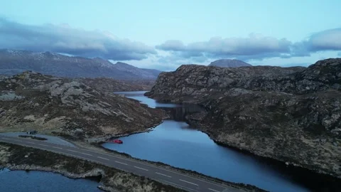 Loch na Thull Flythrough over Fish Farm towards Mountains, Sutherland Scotland Stock Footage 323435035