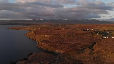 Loch Shore At Sunset, Isle Of Skye, Houses, Mountain Range Aerial 4K Cine D Stock Footage 108871467
