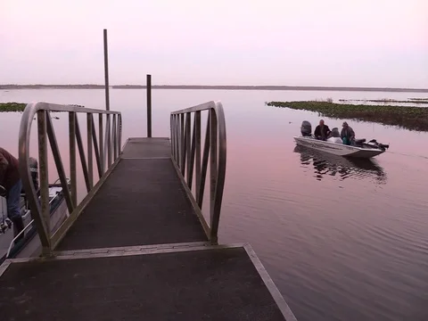 Lochloosa Lake Florida - fishermen heading out at dawn - 6 clips Stock Footage