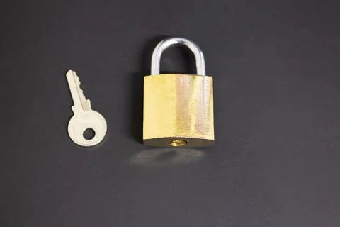 Lock and key on black background Stock Photos