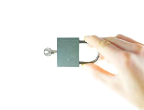 Lock and key in the hands of Stock Photos