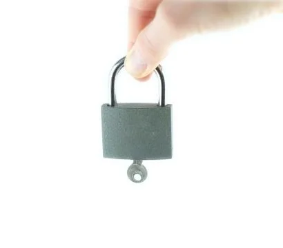 Lock and key in the hands of Stock Photos