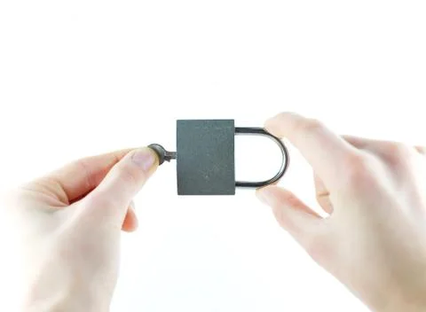Lock and key in the hands of Stock Photos