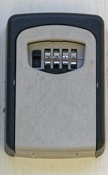 A lock box or key safe is waiting for the right numbers to be entered to open Stock Photos
