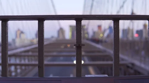 Lock on Brooklyn Bridge with out of focus traffic and people Stock Footage 106262464