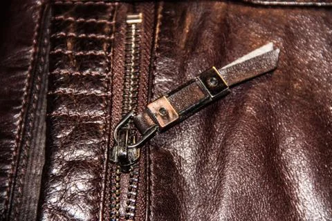 The lock on brown leather with a stitching of thread Stock Photos