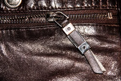 The lock on brown leather with a stitching of thread Stock Photos