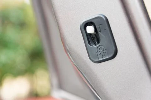 Lock button to prevent children from opening doors Photos