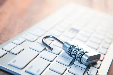 Lock on computer keyboard - vintage effect style pictures. Cyber security c.. 写真素材