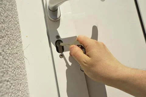 Lock the door with a key Stock Photos