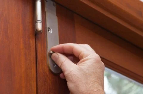 Lock the door for security use latches and locks to keep your house safe Stock Photos