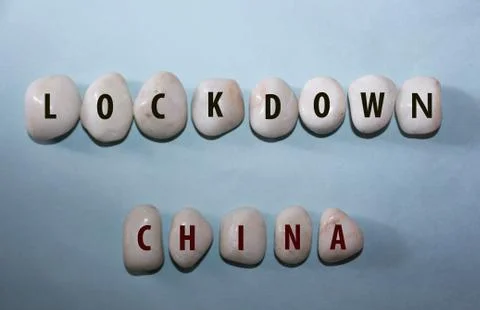 Lock down china text on white rock Stock Photos