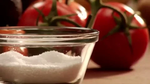 Lock down of hand reaching for a pinch of salt Stock Footage 98247767