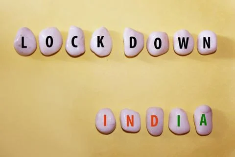 Lock down india text on white rock Stock Photos