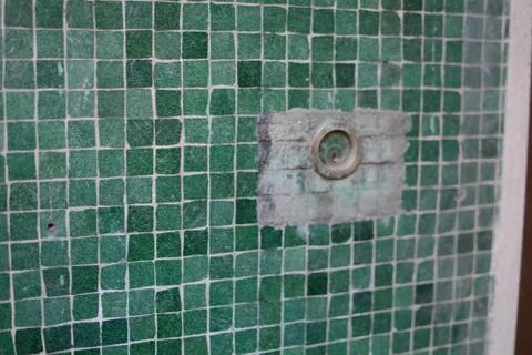 Lock Embedded in Green Tile Wall Stock Photos