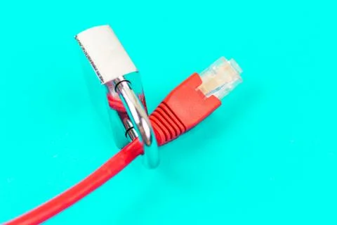Lock on ethernet wire. Internet security concept in blue background Stock Photos