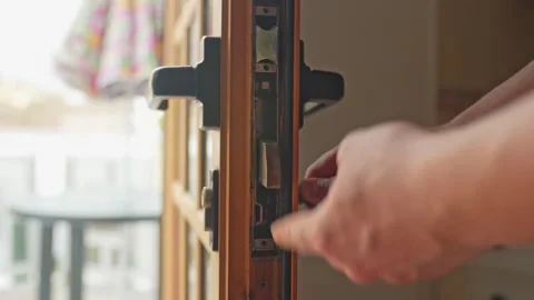 Lock functionality check at a air bnb property doorstep Stock Footage 243549797