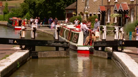 Lock Gate Closes Behind a Narrowboat Stock Footage 56147158