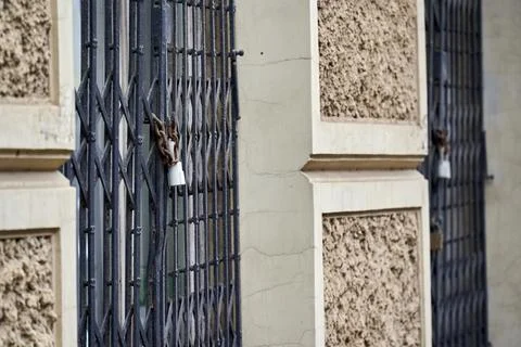 Lock on the grate on the window Stock Photos