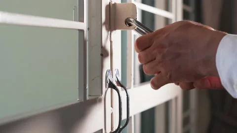 Lock hand closes the door silver chain Stock Footage 218281747