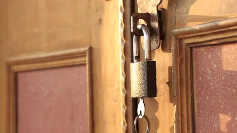 Lock hanging on door. Stock Footage 169585523