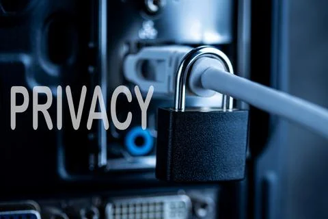 Lock hanging on a network cable. Stock Photos