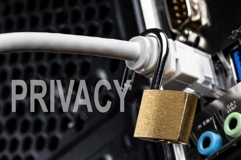 Lock hanging on a network cable. Stock Photos