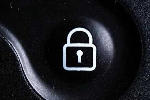 The lock icon button is close on the digital car key device. Old and dirty Stock Photos