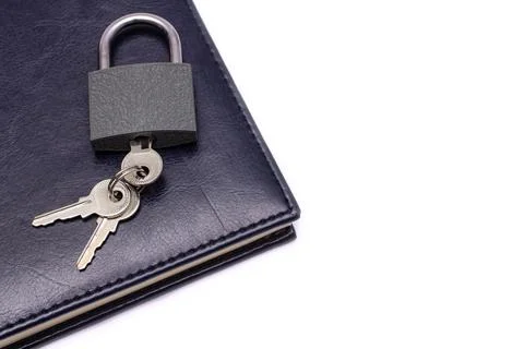 Lock with keys on a blue Notepad on a white background. the concept of privac Stock Photos