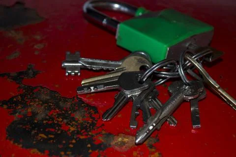 Lock with keys on a red old safe. Stock Photos