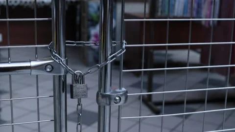 The lock on the lattice closes access to the forbidden part of the market Stock Footage