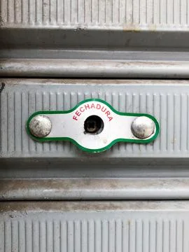 Lock on Metallic Rolling Door Stock Photos