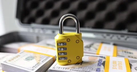 Lock with numbers on dollars in suitcase closeup Stock Footage 234593269