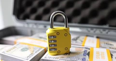 Lock with numbers on dollars in suitcase closeup Stock Footage 256294232