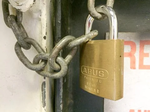 Lock padlock locked on chain to lockdown area out concept Stock Photos