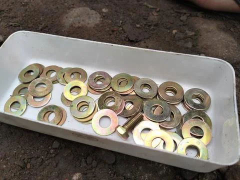 A lock ring is a thin plate typically used to distribute the load of a threaded  Stock Photos