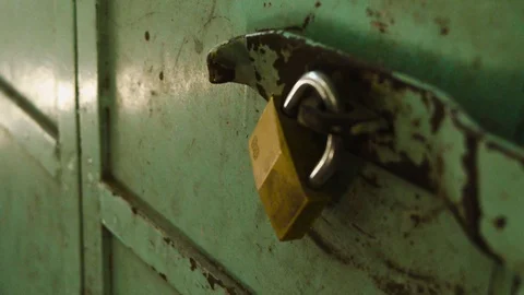 Lock On Rusty Iron Door. Closed Old Green Rusty Door Stock Footage 91440287