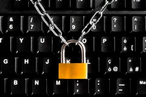Lock security with chain on black keyboard. computer security concept Stock Photos