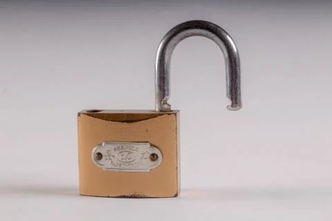 Lock with unlock on white background Stock Photos