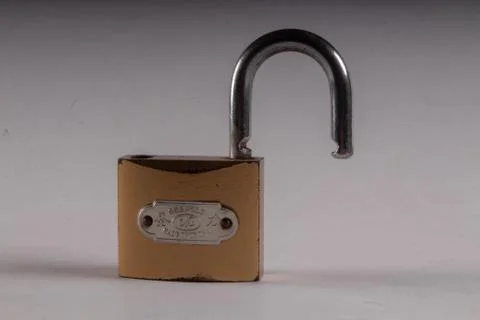 Lock with unlock on white background Stock Photos