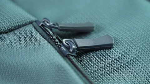 Lock zipper of a colored tourist backpack close-up Stock Footage 220704344