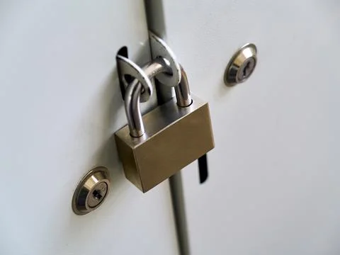 Lockable metal locker with padlock, safe place to store equipment. Selective Stock Photos