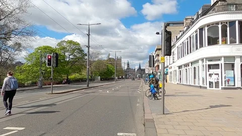 Lockdown Edinburgh Covid 19 Coronavirus 2020 cyclists Princes Street Scotland UK Stock Footage 129891886