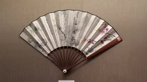 Lockdown: Folding fan with floral pattern and Chinese script - Suzhou, China Stock Footage 149672566