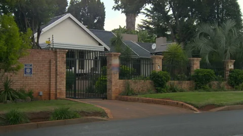Lockdown Of The Front Of A Suburban Home And Driveway, With A Brick And Iron Vídeos de archivo 152807255