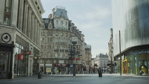 Lockdown London, Empty Leicester Square with Swiss glockenspiel clock during cor Stock Footage 127966032