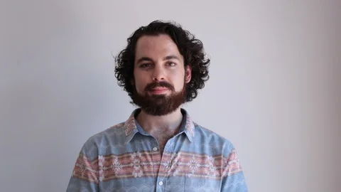 Lockdown portrait shot of confident young man against white background Stock Footage 114859568