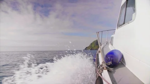 Lockdown Shot Of Boat Moving Towards Skellig Michael Island Video stock 86066946